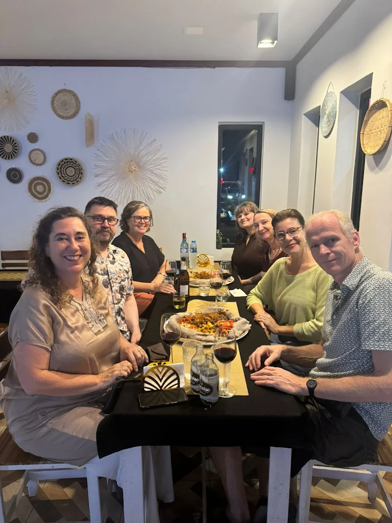 Happy guests sharing an Ethiopian meal at Injera Restaurant, Vientiane